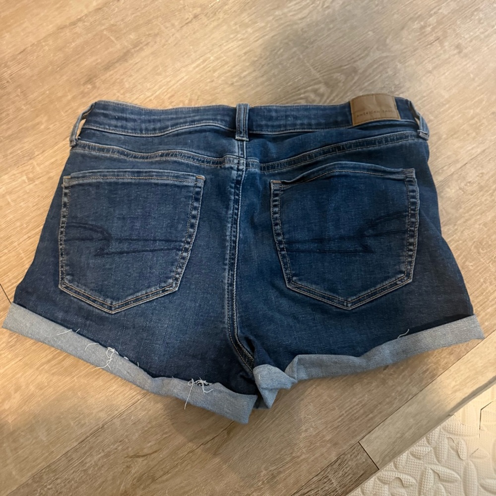 American Eagle High rise shortieNext level Stretch Dark Blue Rolled Denim Shorts - Picture 2 of 5